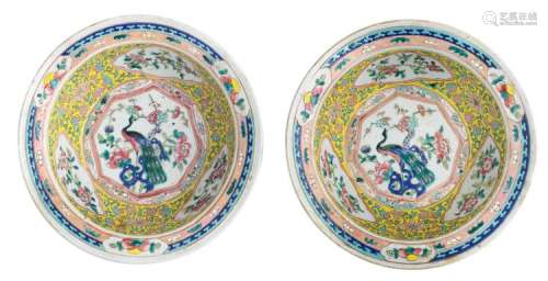 Two Chinese famille rose and polychrome floral decorated bowls, the medallion with a peacock on a rock and flower branches, 19thC, H 9,5 - ø 30 cm