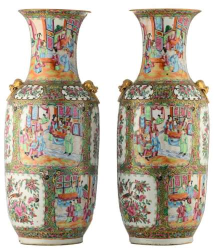 A pair of Chinese Canton famille rose floral decorated vases, the roundels with various court scenes, birds and butterflies on flower branches, 19thC, H 62 cm