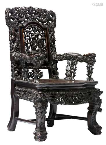 A Chinese richly carved hardwood dragon decorated armchair, the open work back decorated with an animated scene, H 99 - W 62 - D 57 cm