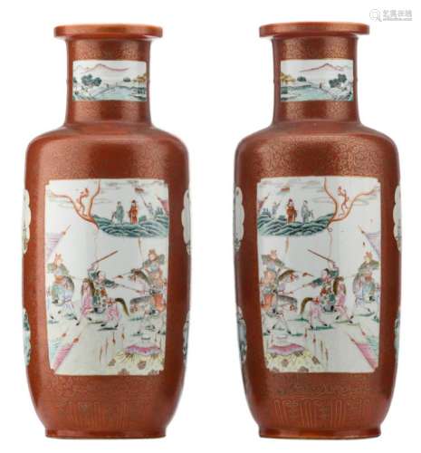 A pair of Chinese orange ground famille rose and gilt decorated rouleau shaped vases, the roundels with warriors, landscapes and animated scenes, with a Qianlong mark,  H 46 cm