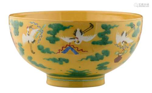 A Chinese yellow polychrome overall decorated bowl with cranes carrying the symbols of the Eight Immortals, inside two cranes with a Shu character, with a Yongzheng mark, H 15 - ø 29 cm