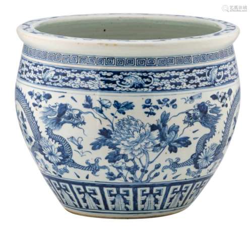 A Chinese blue and white jardiniere, overall decorated with dragons, bats and flower branches, the neck with frieze pattern, H 30 - ø 36,5 cm