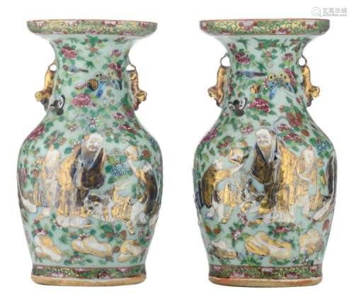 A pair of Chinese Canton celadon ground famille rose floral decorated vases, one side with an animated scene, the other side with court scenes, 19thC, H 34 cm