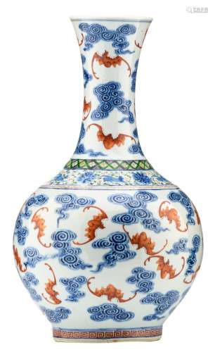 A fine Chinese underglaze blue and polychrome bottle vase, decorated with bats amid clouds, with a Kangxi mark, H 40,5 cm