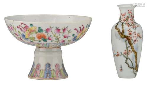 A Chinese porcelain stemcup, overall famille rose decorated with peaches, birds, butterflies i.e., 19th - 20thC; added a ditto miniature vase decorated with flowerbranches, Republic, marked; H 11,3 - 13,7 - Ø 16,6 cm (stemcup)