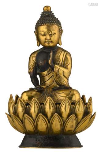 A Sino-Tibetan gilt bronze Buddha seated on a lotus, H 21 cm