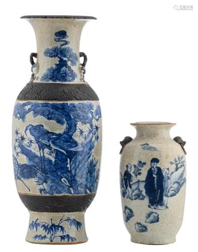 A Chinese blue and white stoneware baluster shaped vase, decorated with cranes and a deer in a landscape, marked, about 1900; added a ditto vase, decorated with figures in a garden, H 32 - 60,5 cm