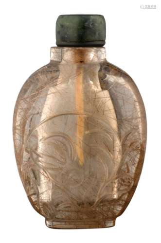 A Chinese carved rock crystal snuff bottle, decorated with rabbits, with spinach jade stopper, 19thC, H 6 cm