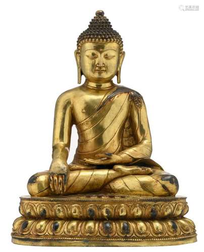 A Chinese gilt bronze seated Buddha on a ditto lotus base, H 46 cm