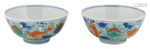 Two Chinese doucai bowls, decorated with carps amongst aquatic plants, with a Xuande mark, H 8,5 - ø 18 cm