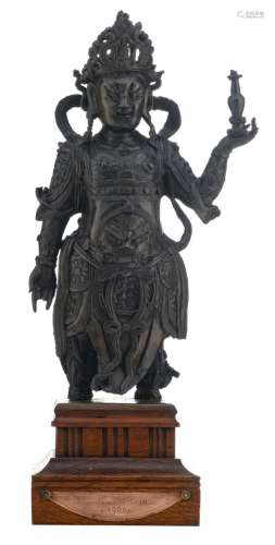 A Chinese bronze warrior on a wooden matching base, possibly Ming, H 34 (without base) - 44,2 cm (with base)