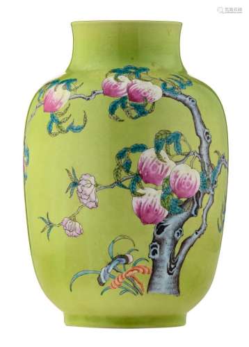 A Chinese lime ground famille rose decorated begonia shaped nine peaches vase, marked, H 24,5 cm