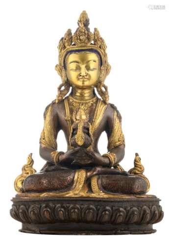 A 19th / 20thC Sino-Tibetan partly gilt and polychrome painted bronze seated Buddha, H 24,2 cm