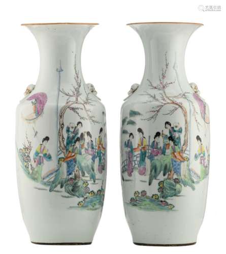 A pair of Chinese famille rose vases, decorated with court ladies in a garden and calligraphic texts, H 57 - 57,5 cm