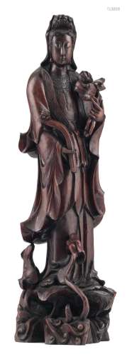 A Chinese hardwood sculpture, depicting a Guanyin, standing on a lotus base, H 92,5 cm