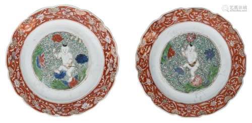 Two Chinese famille verte plates, floral decorated, the medallion with a boy among lotus, marked, ø 21 cm