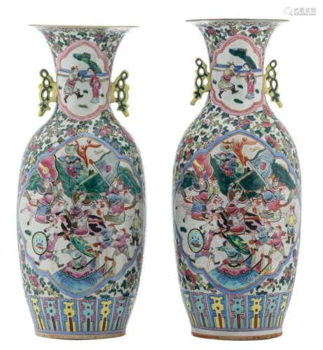 Two Chinese famille rose floral decorated vases, the panels with warriors and a court scene, marked, H 57,5 - 58 cm
