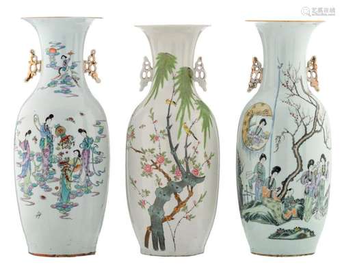 Two Chinese famille rose vases, one vase decorated with court ladies in a garden, the other vase with deities amongst clouds, both vases with calligraphic texts; added a ditto vase with birds on flower branches, H 57,5 - 59,5 cm