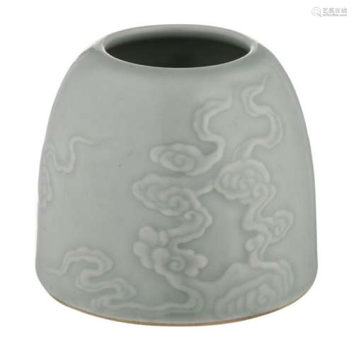 A Chinese celadon glazed relief moulded waterpot, overall decorated with clouds, with a Kangxi mark, H 7 cm