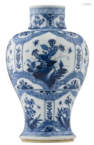 A Chinese blue and white baluster shaped vase, the roundels decorated with flower branches and butterflies, with a symbol mark, 18th / 19thC, H 30 cm