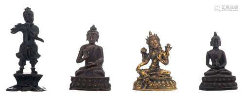 A Chinese seated gilt bronze Bodhisattva, a bronze and a brass seated Buddha; added a patinated bronze figure depicting Han Xiangzi, H 10 - 14,3 cm