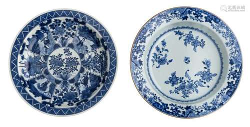 A Chinese blue and white floral decorated Kangxi charger, 18thC; added a Chinese blue and white plate, the panels decorated with figures in landscapes and flower branches, with a symbol mark, H 6 - 8 - ø 37,5 - 38 cm