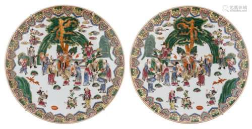 A pair of Chinese famille rose plates, decorated with Immortals in their habitat, with a Qianlong mark, 20thC, ø 45,5 cm