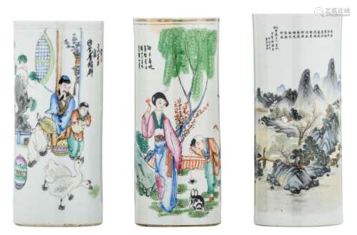 Three Chinese famille rose and polychrome cylindrical vases, two vases decorated with figures in a garden and one with a mountainous river landscape, all with calligraphic texts, one marked, H 27 - 28 cm