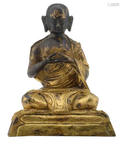 A Sino-Tibetan gilt bronze seated Buddha, H 15 cm