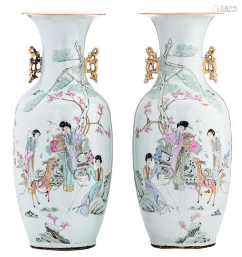 A pair of Chinese famille rose vases, decorated with three ladies and a deer in a garden and calligraphic texts, H 56,5 cm