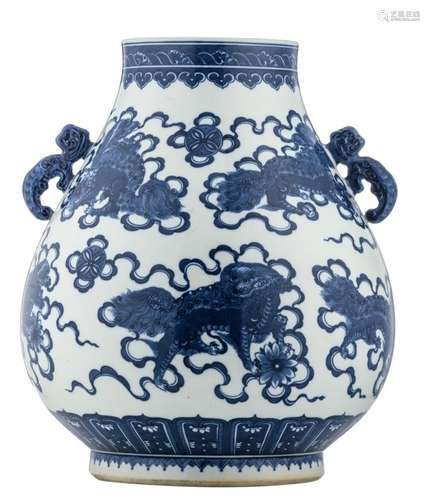 A Chinese blue and white overall decorated Hu vase with Fu lions and Buddhistic symbols, the handles dragon shaped, with a Qianlong mark, H 47,5 cm