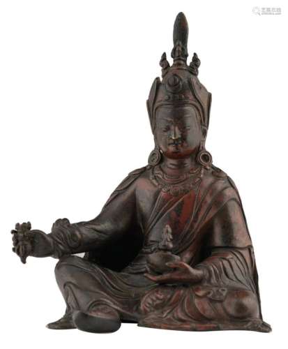 A Northern Indian / Tibetan patinated and polychrome seated bronze Buddha with a Sanskrit inscription, H 16,1 cm