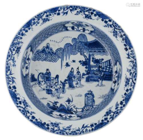 A Chinese blue and white floral decorated charger, the medallion with an animated garden scene, 18th / 19thC, H 9 - ø 42,5 cm