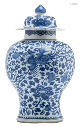A Chinese blue and white vase and cover, overall decorated with flower branches and a phoenix, 18thC, H 43 cm