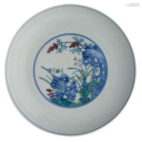 A Chinese doucai plate, overall decorated with flower branches, lingzhi and rocks, with a Yongzheng mark, ø 21,5 cm