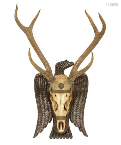 A hunting trophy with an eagle shaped frame, H 83,5 - W 58 cm