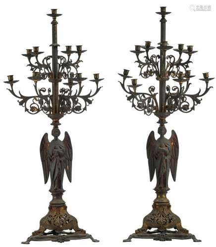 A pair of Gothic revival brass church candelabras with traces of gilt decoration, first quarter of the 20thC, H 110 cm