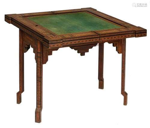 A multifunctional game table in the Moorish manner, with typical geometric marquetry in mother-of-pearl, ebony and various other types of wood, can be used as a card table, as a backgammon table, as damboard table, etc., H 84 - W 89 - D 44,5 cm