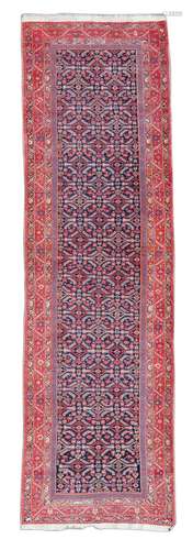 An Oriental runner, decorated with stylised floral motifs, Iran, wool on cotton, 109 x 384 cm