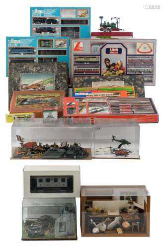 Four boxes with LIMA trains (incomplete), one JOUEF box, one PRIMEX box, one ROCO box, three display cabinets with various items, three boxes with various items; added three pre 1950's model trains in their original boxes