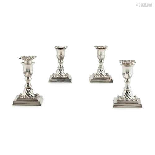 A matched set of four Victorian dwarf table candlesticks Height: 11.5cm