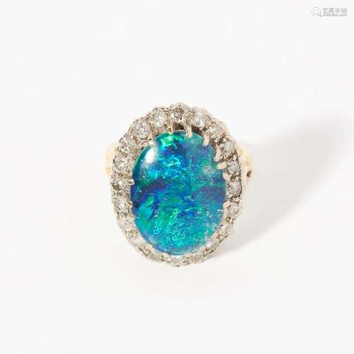 A black opal triplet and diamond set cluster ring Ring size: K/L