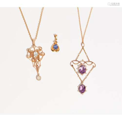 A collection of three pendant necklaces