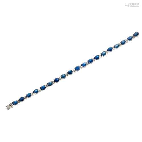 An 18ct gold sapphire and diamond set line bracelet Length: 18cm, estimated total gem weights: sapphires 18.27cts, diamonds 1.32cts