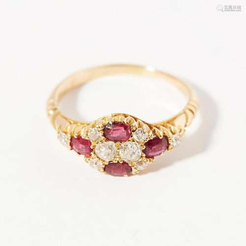 A ruby and diamond set cluster ring Ring size: J/K