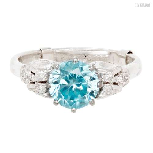 A blue zircon and diamond cluster ring Ring size: O/P