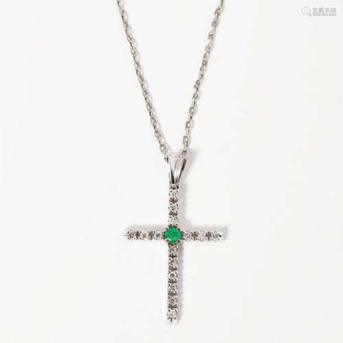 An diamond and emerald set pendant cross Length of pendant (including bale): 42mm, estimated total diamond weight: 0.50cts