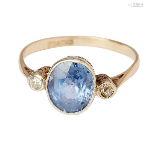 A sapphire and diamond set three stone ring Ring size: T/U