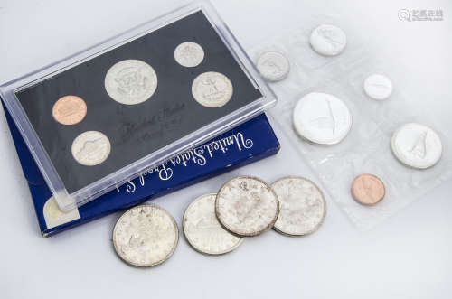 Four 1966 Canadian silver dollar coins