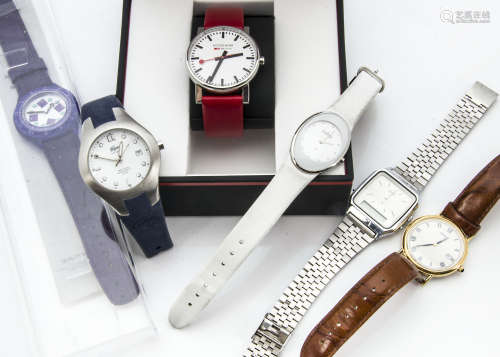 A group of modern wristwatches